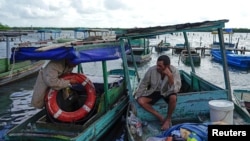 Foto de archivo. Pescadores en Isabela de Sagua, Cuba, el 28 de enero de 2023. REUTERS/Alexandre Meneghini